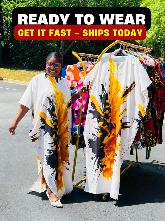 Woman wearing a vibrant, floor-length African print Bubu dress with wide sleeves and a relaxed fit, standing outdoors.