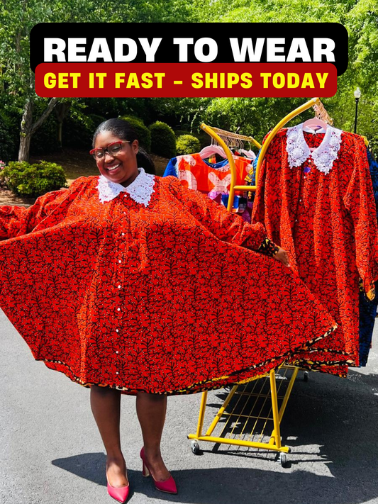 Woman wearing a vibrant Ankara full-circle A-line dress with a lace collar, standing outdoors.