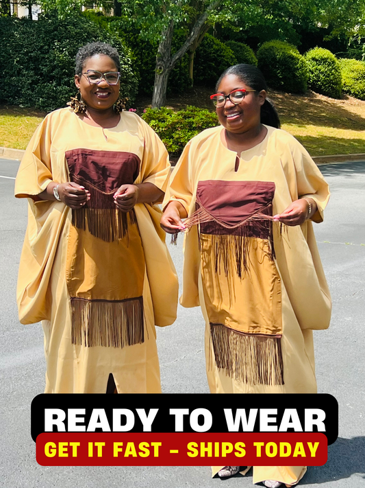 Woman wearing a plain crepe Bubu gown with wide sleeves and a relaxed fit, standing outdoors.