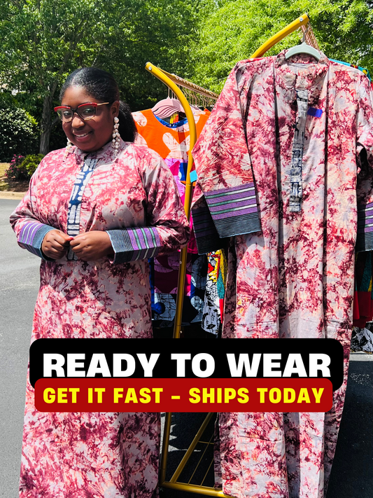 Woman wearing a boho-style maxi dress featuring vibrant Kampala Adire print and Aso Oke accents, with a relaxed fit and wide sleeves.