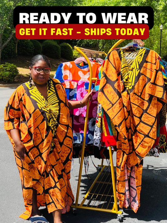 Woman wearing a vibrant, floor-length Ankara Bubu gown with wide sleeves and a relaxed fit, standing outdoors.